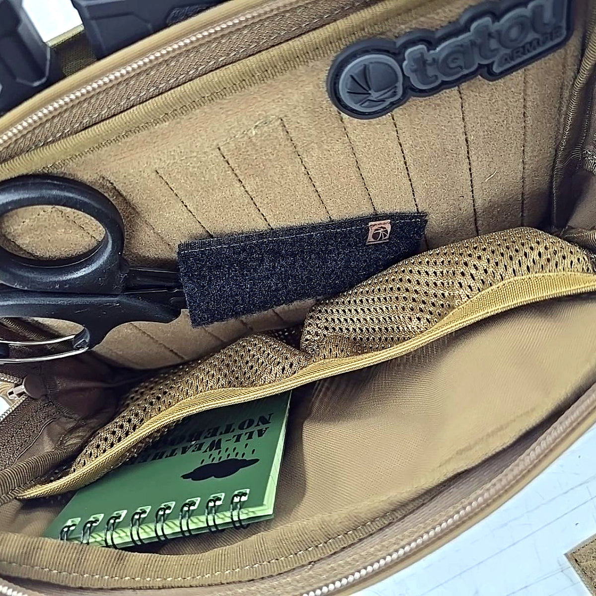 Tatou Armor Universal Shear Holder installed inside a plate carrier admin pouch