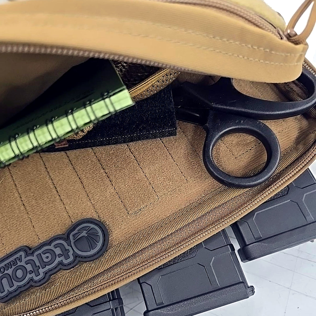 Close-up of Tatou Armor Universal Shear Holder behind a magazine insert