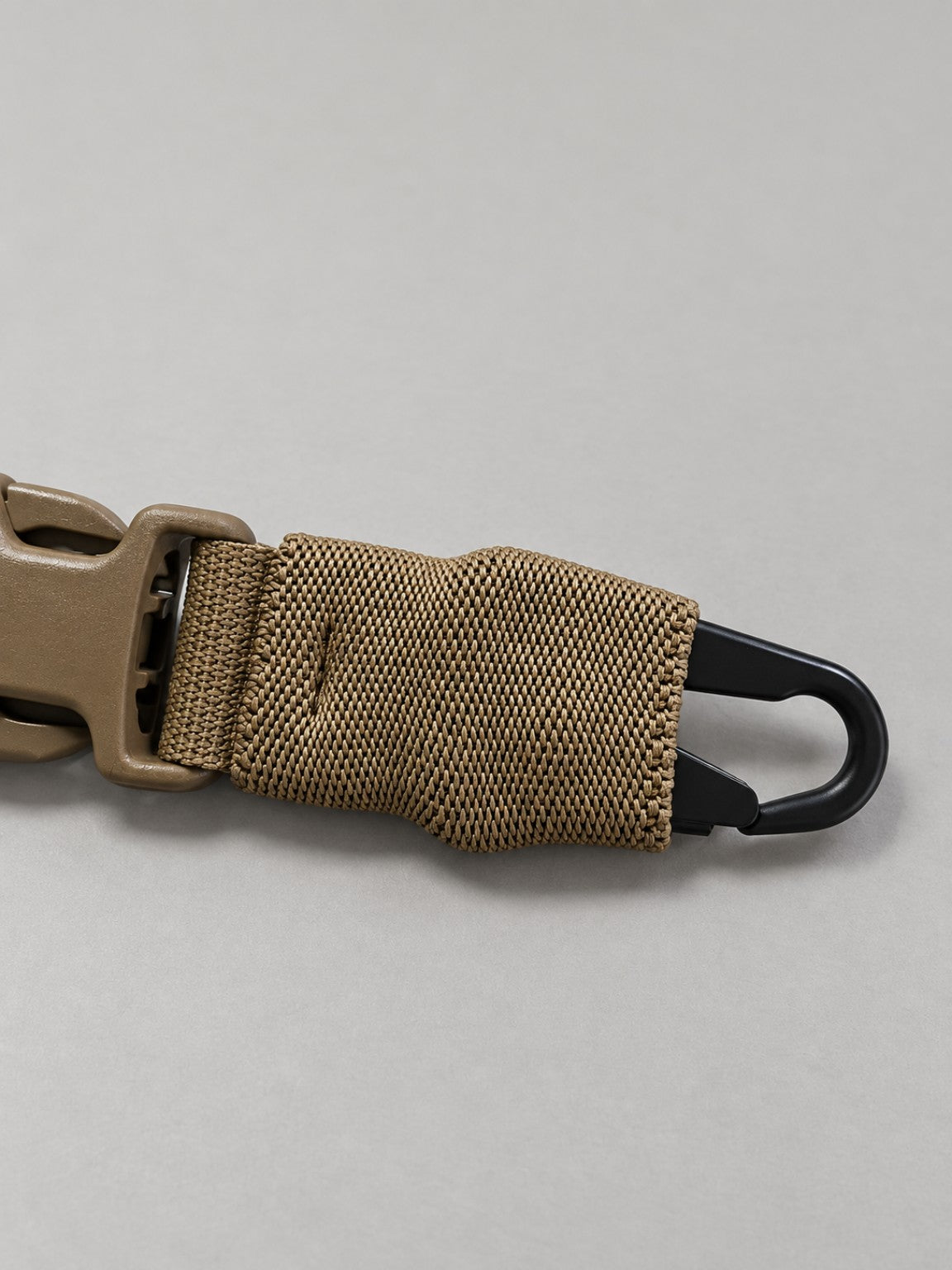 Black HK-style hook detail on Tatou Armor Fast Adjustable Bungee Sling
